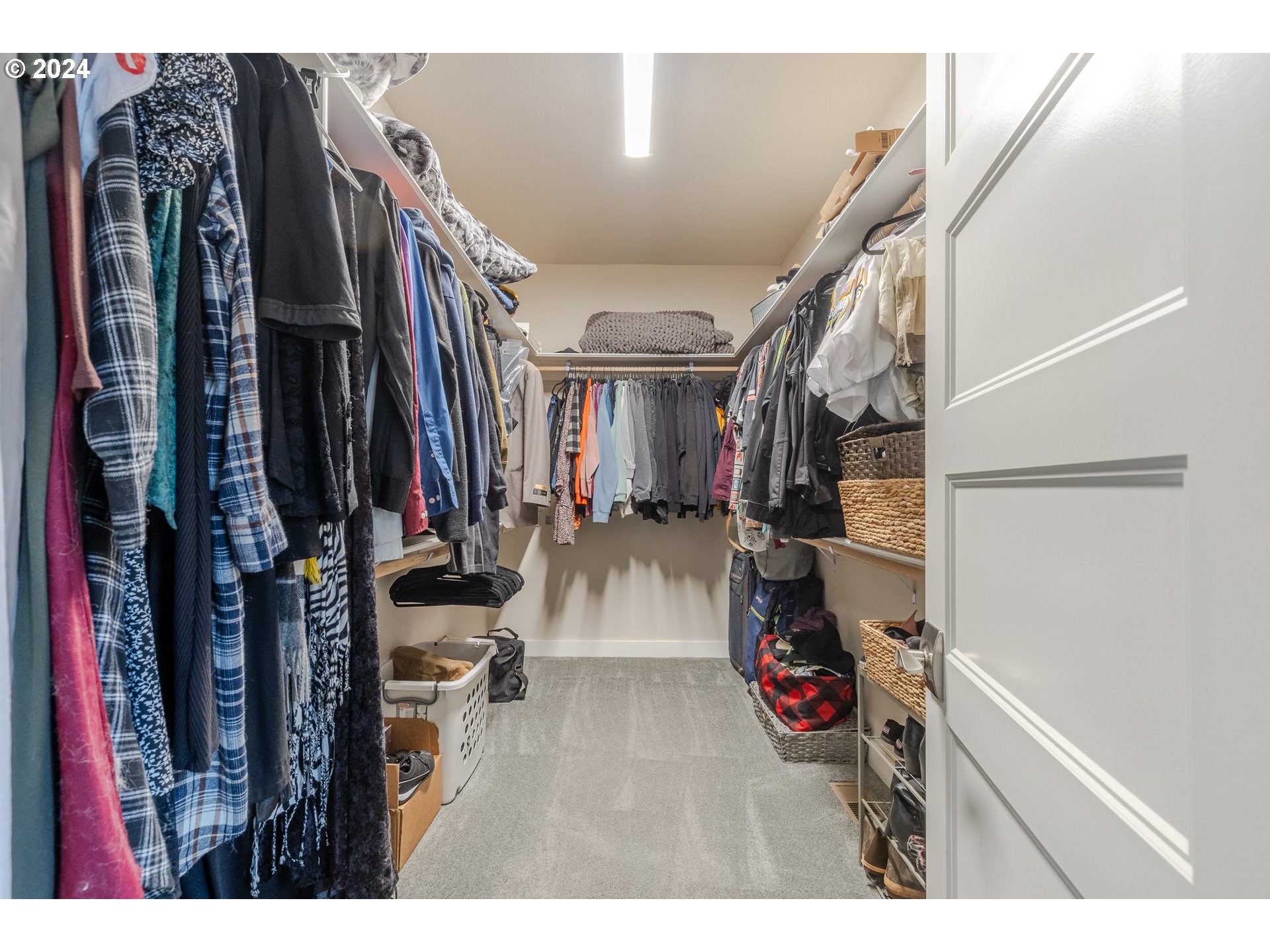 1026 West Olympic Street Springfield, OR 97477 - Photo 19 of 31 a view of walk in closet with clothes and shoes