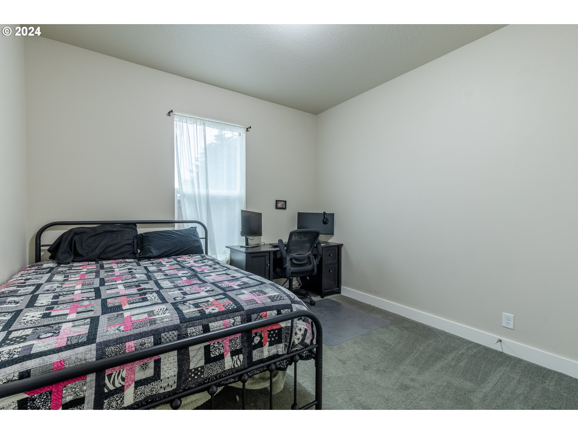 1026 West Olympic Street Springfield, OR 97477 - Photo 25 of 31 a bedroom with a bed a table and chair