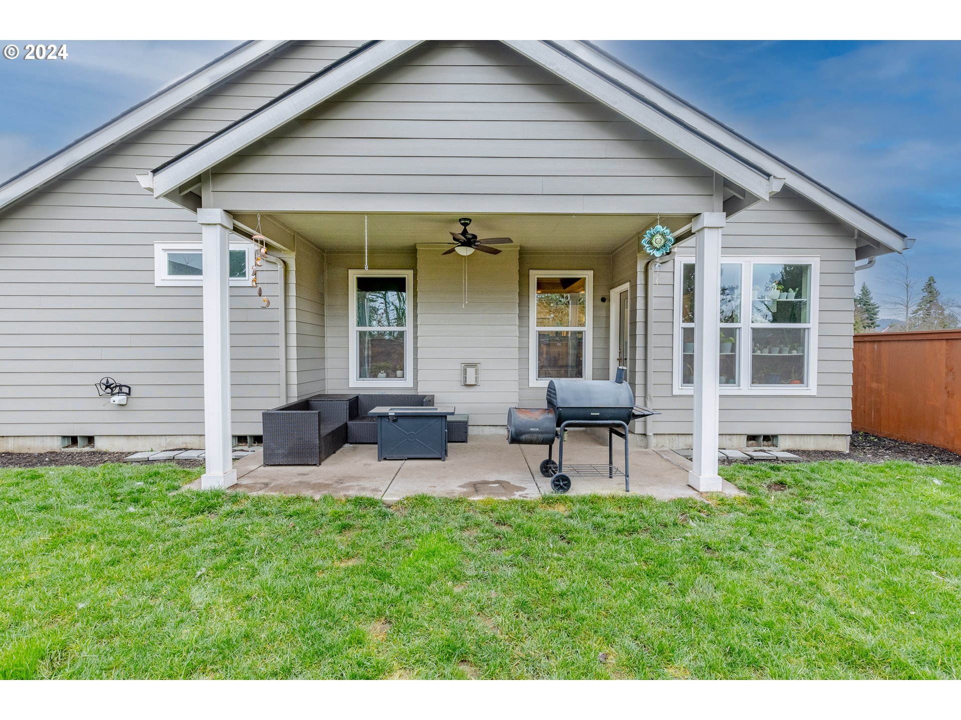 1026 West Olympic Street Springfield, OR 97477 - Photo 27 of 31 a view of a house with a backyard and chairs