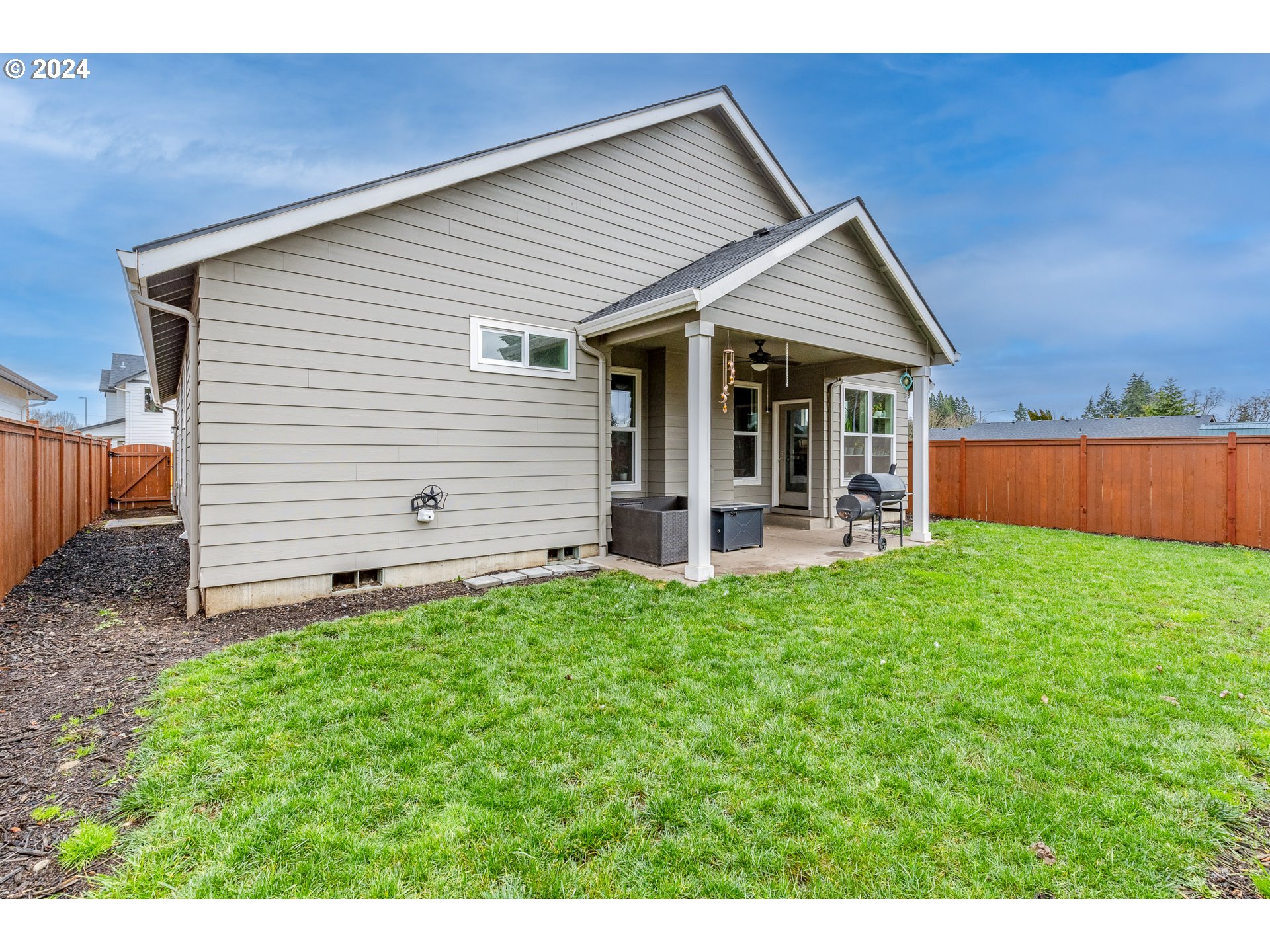 1026 West Olympic Street Springfield, OR 97477 - Photo 28 of 31 a front view of house with backyard and green space