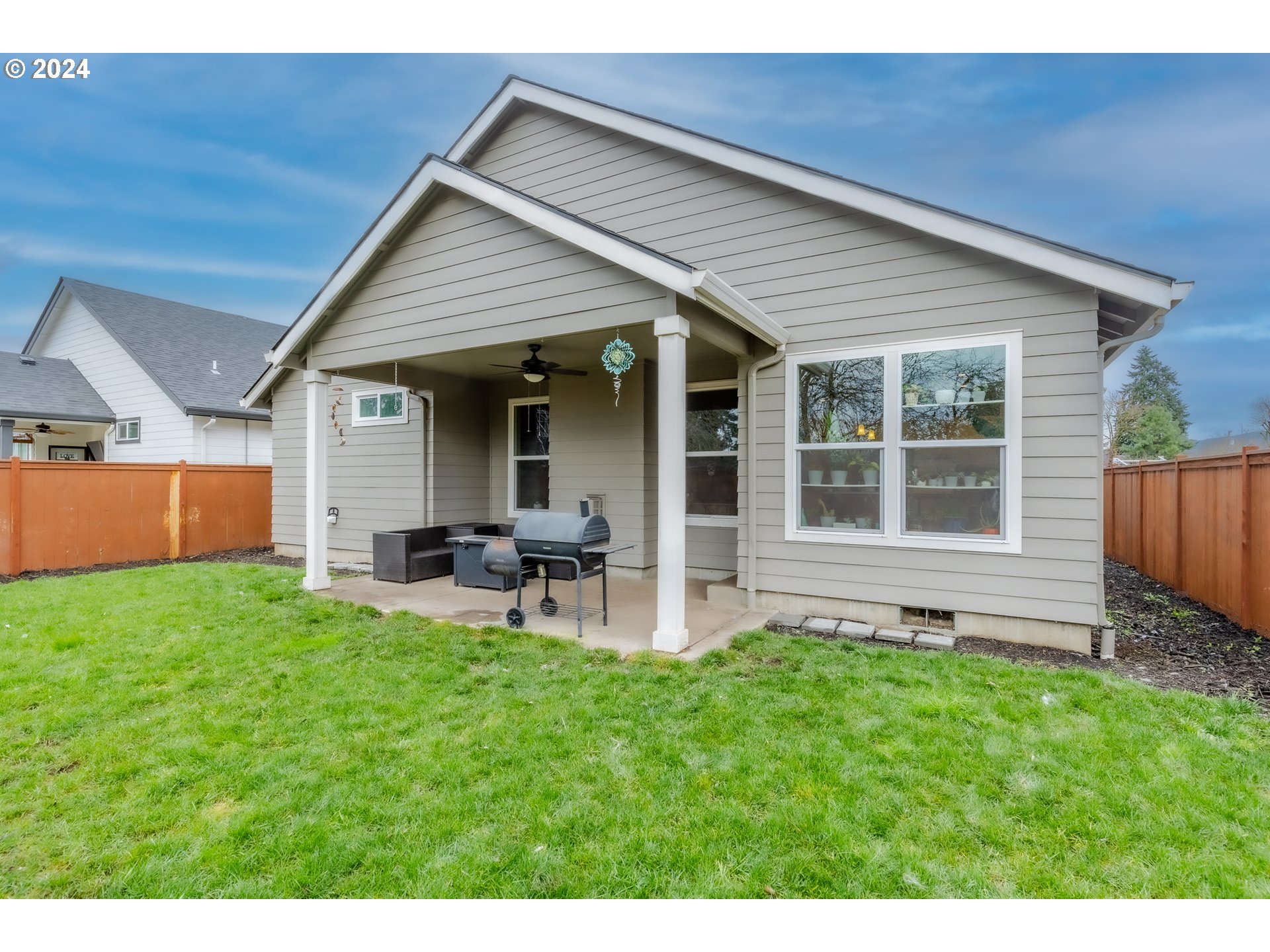 1026 West Olympic Street Springfield, OR 97477 - Photo 29 of 31 a backyard of a house with table and chairs
