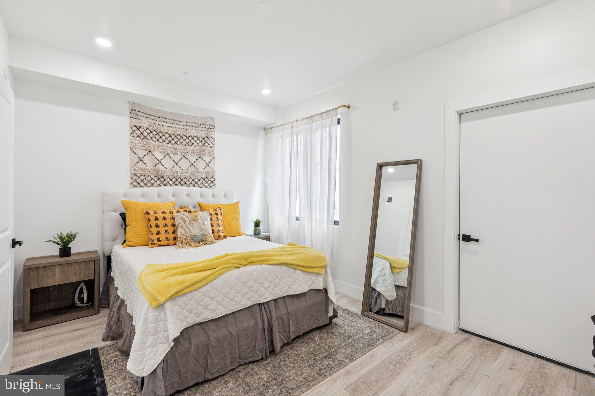 1602 Ridge Avenue, Unit 3 Philadelphia, PA 19130 - Photo 14 of 17 a bedroom with a bed and a refrigerator