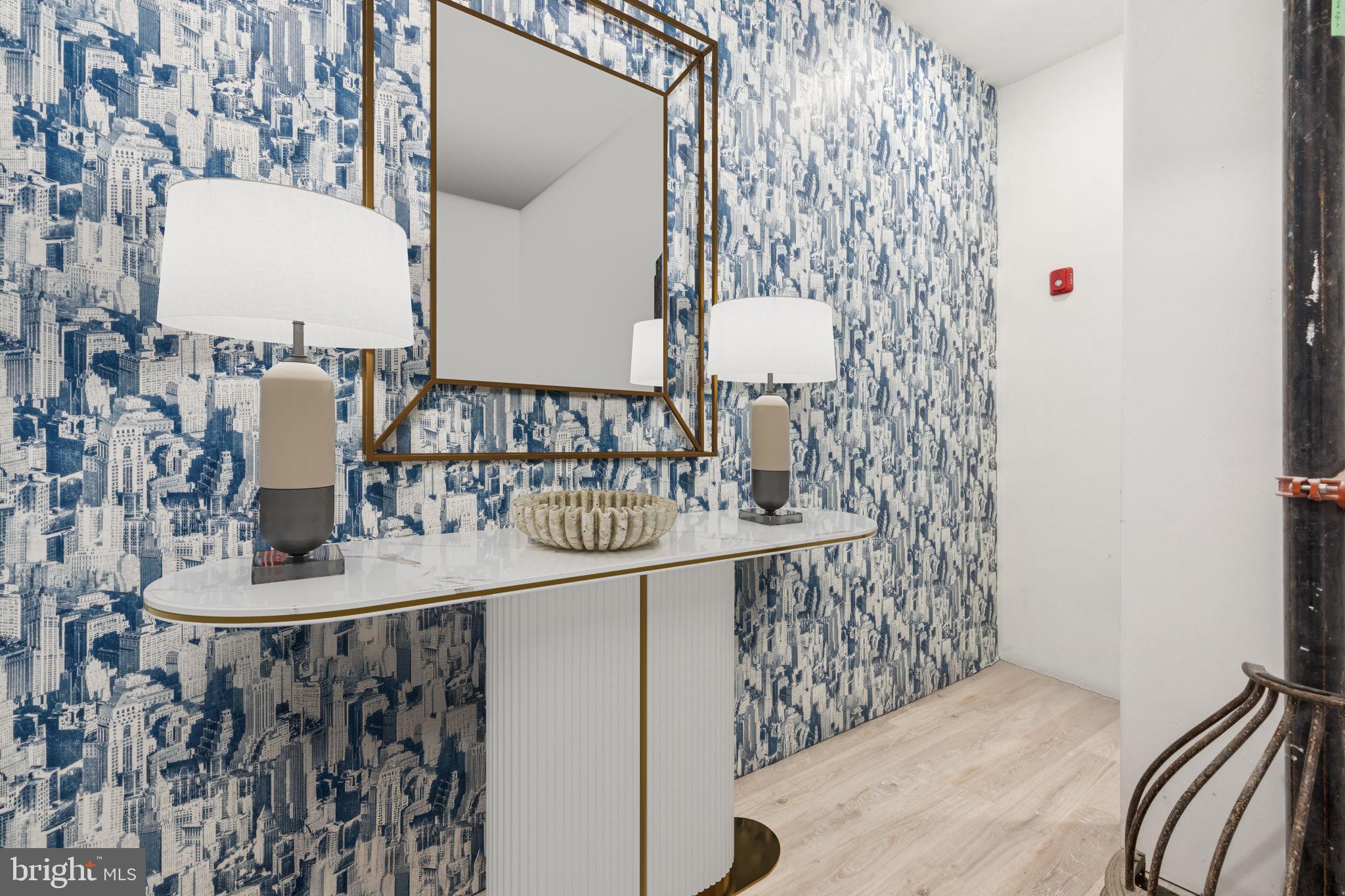 1602 Ridge Avenue, Unit 3 Philadelphia, PA 19130 - Photo 15 of 17 a bathroom with a sink and mirror with painted walls