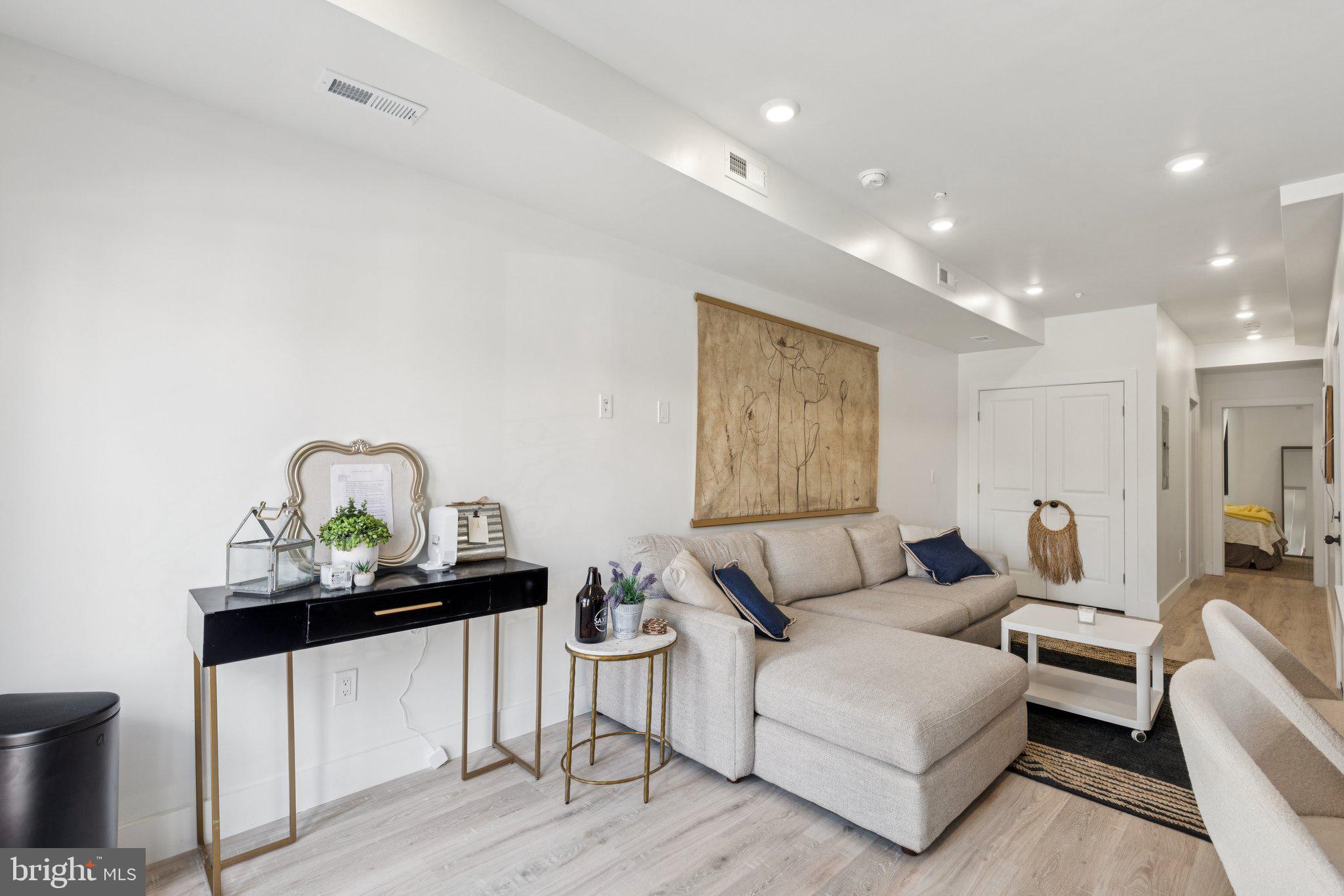 1602 Ridge Avenue, Unit 3 Philadelphia, PA 19130 - Photo 4 of 17 a living room with furniture and wooden floor
