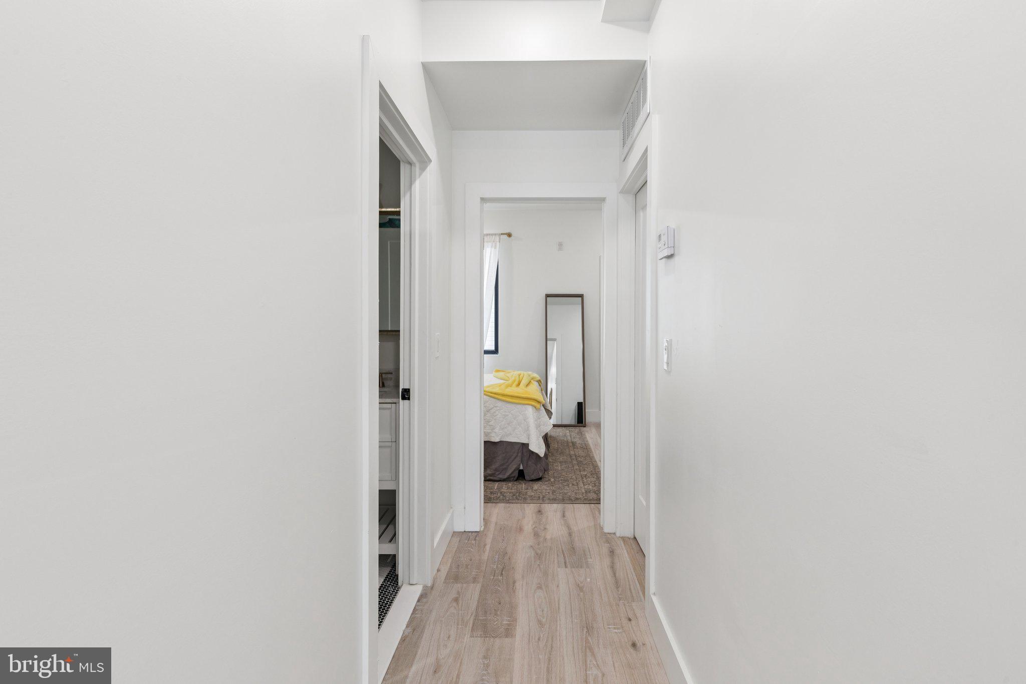 1602 Ridge Avenue, Unit 3 Philadelphia, PA 19130 - Photo 9 of 17 a view of a bedroom from a hallway