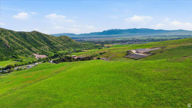 Expansive green hillsides featuring varied terrain