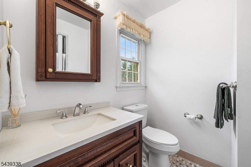 1 Oak Grove Road Flemington, NJ 08822 - Photo 17 of 29 a bathroom with a granite countertop toilet sink and mirror