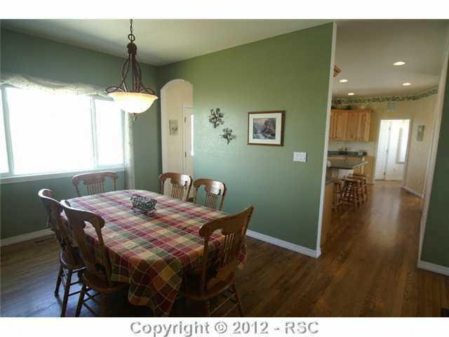12490 Old Barn Road Elbert, CO 80106 - Photo 6 of 16 Formal dining room with wood floors.