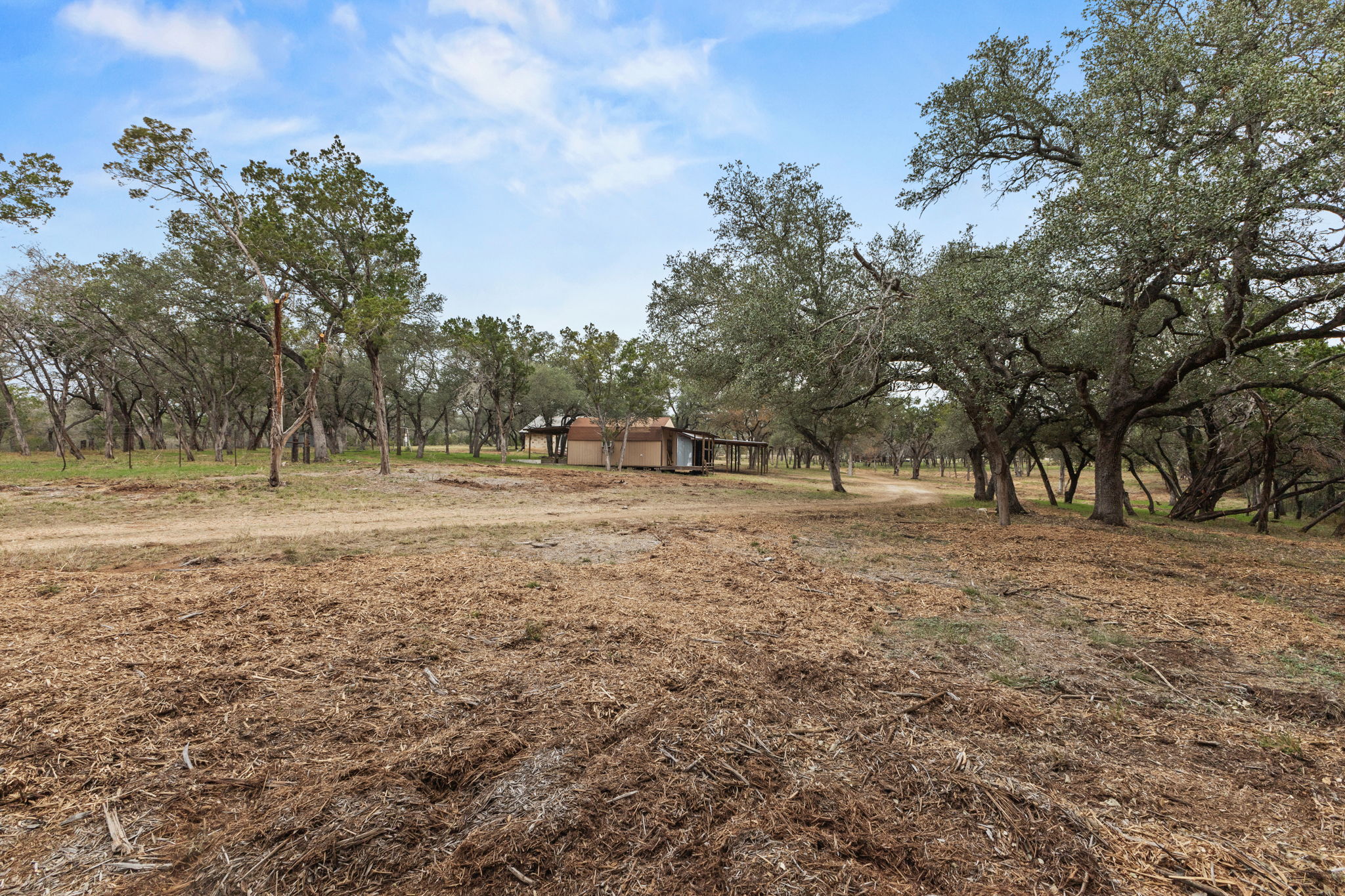 122 Winding Creek Road Spicewood, TX 78669 - Photo 2 of 19 a view of outdoor space with trees