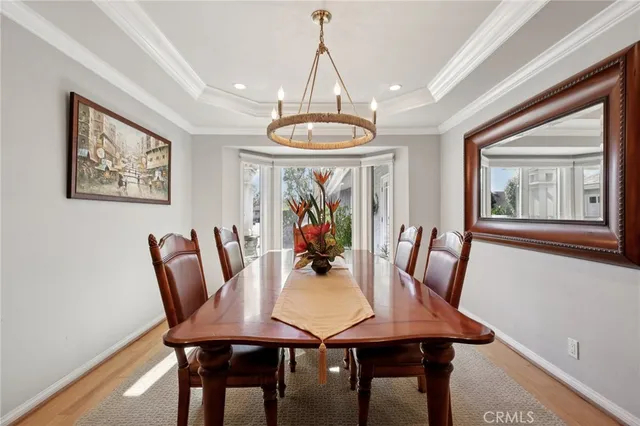 a living room with furniture a fireplace and a table