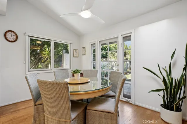 a kitchen with stainless steel appliances granite countertop a stove a sink dishwasher and cabinets with wooden floor