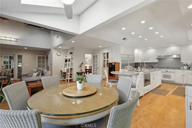 a kitchen with a sink stainless steel appliances and cabinets