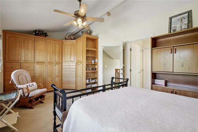 a large white room with table and chairs