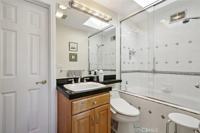 a spacious bedroom with a bed and a walk in closet