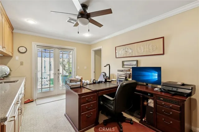a view of a hallway to a livingroom with furniture and a hallway