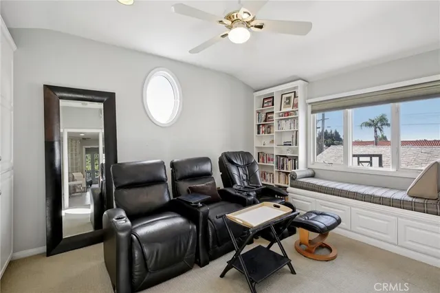 a kitchen with cabinets wooden floor and stainless steel appliances