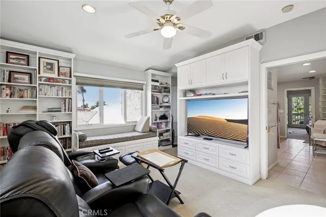 a view of a workspace with furniture and a kitchen