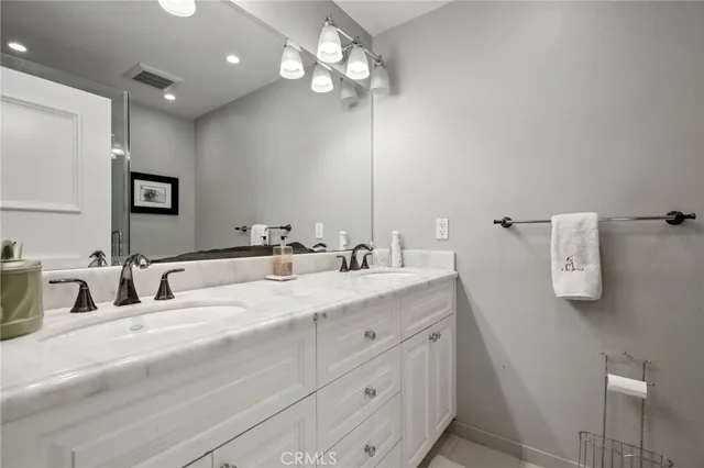 a view of a swimming pool with a patio and a yard