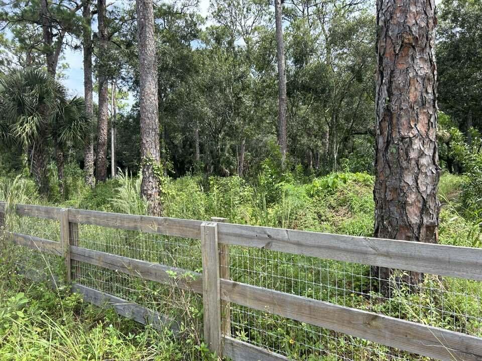 14439 Collecting Canal Road Loxahatchee Groves, FL 33470 - Photo 1 of 4 a view of a fence