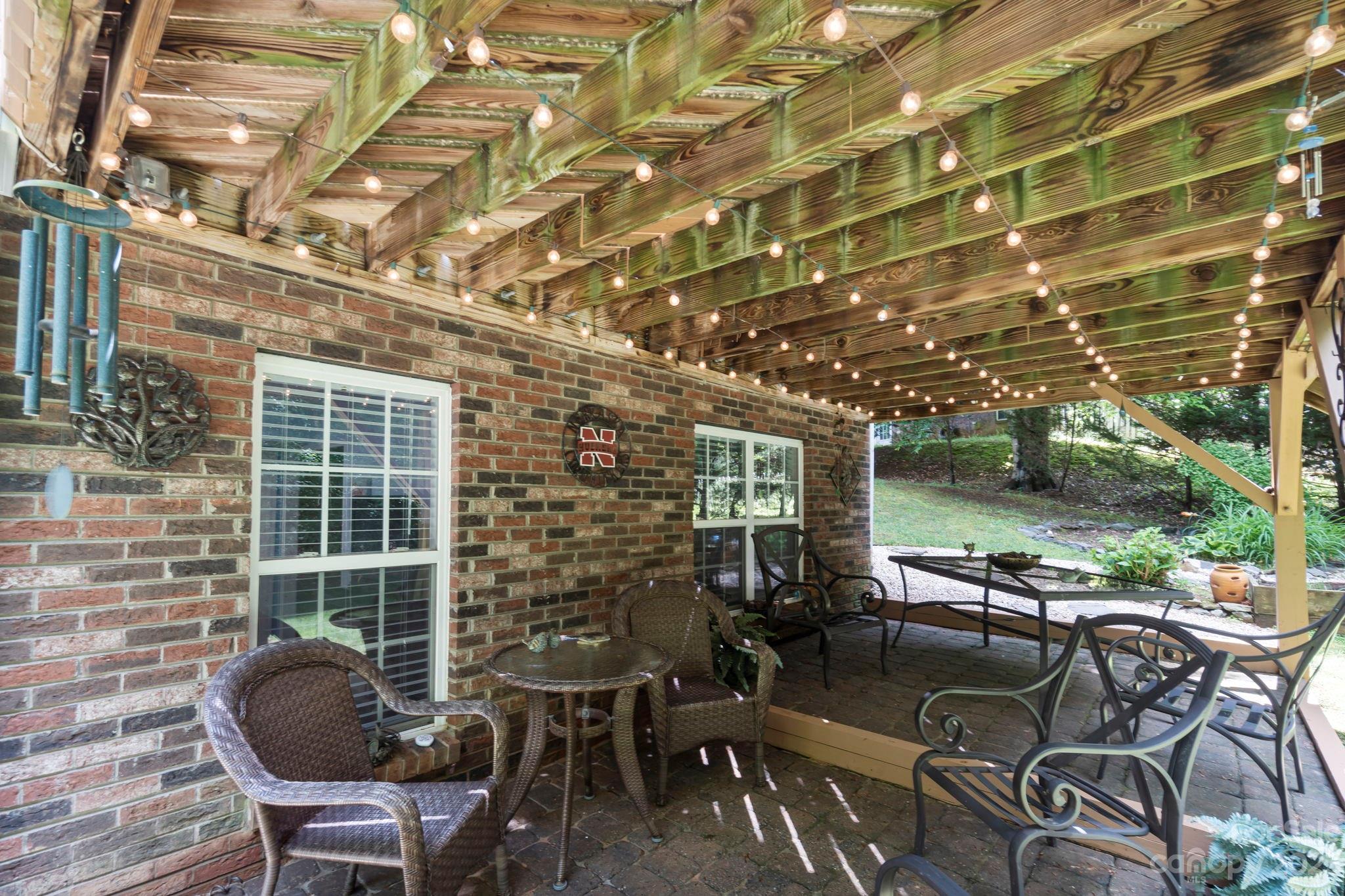 6521 Emory Drive Hickory, NC 28601 - Photo 25 of 28 a view of a patio with table and chairs and potted plants