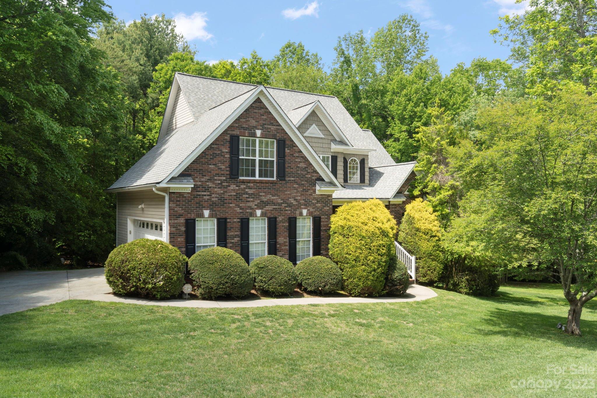 6521 Emory Drive Hickory, NC 28601 - Photo 28 of 28 a front view of a house with a garden