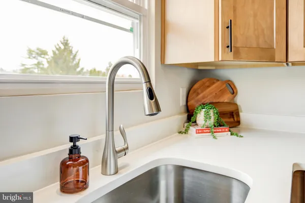 a kitchen with a sink and a window