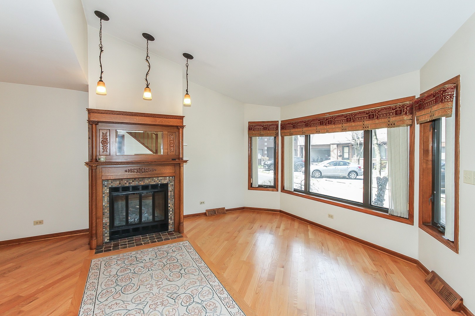 70 South Dee Road, Unit A Park Ridge, IL 60068 - Photo 2 of 20 a view of an empty room with a fireplace and a window