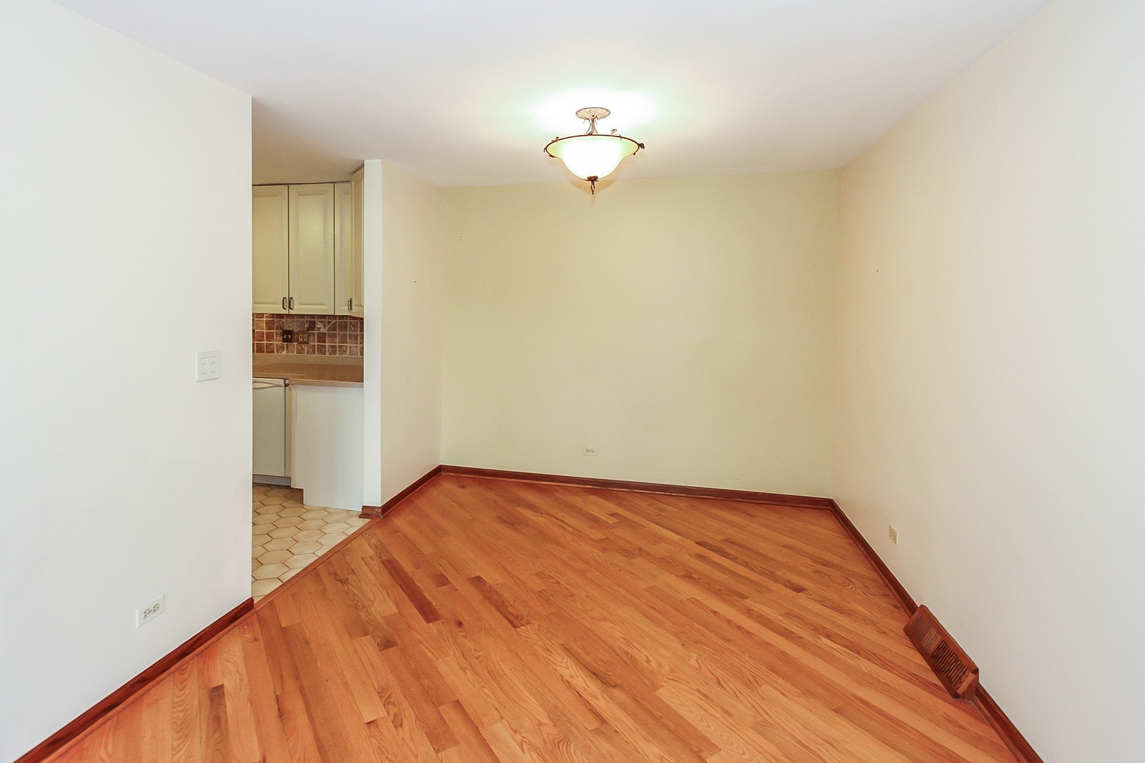70 South Dee Road, Unit A Park Ridge, IL 60068 - Photo 5 of 20 a view of a room with wooden floor and staircase