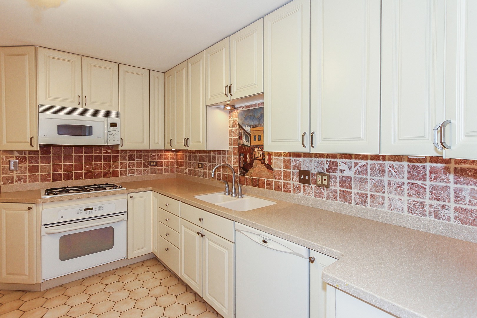 70 South Dee Road, Unit A Park Ridge, IL 60068 - Photo 6 of 20 a kitchen with granite countertop white cabinets and white appliances