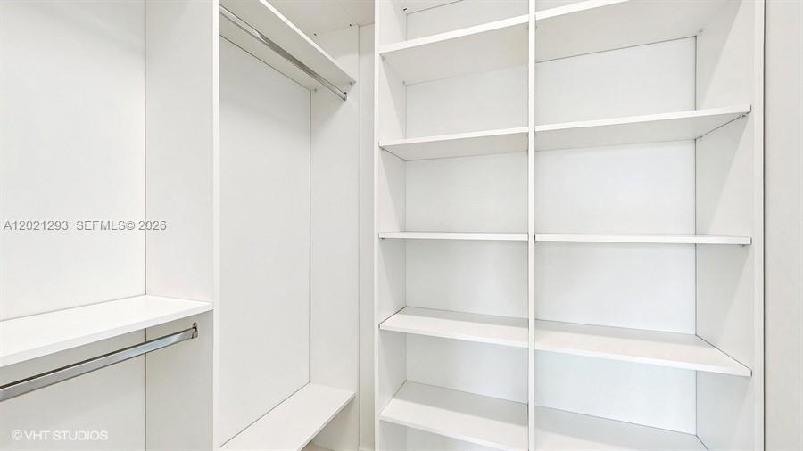 8350 Royal County Down Road Boca Raton, FL 33434 - Photo 26 of 52 a view of an empty walk in closet