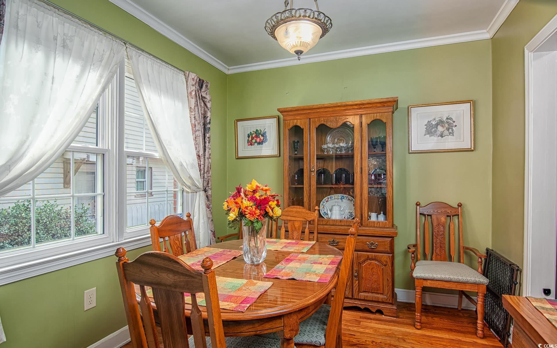 310 St James Street Georgetown, SC 29440 - Photo 6 of 25 Dining room featuring ornamental molding and wood finished floors