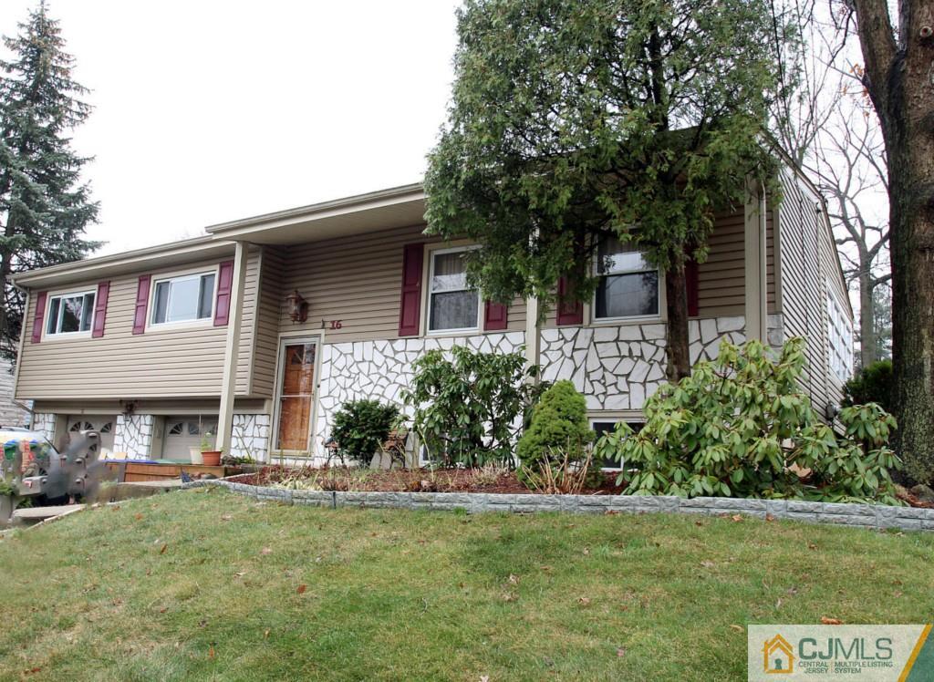 16 Gales Road Edison, NJ 08837 - Photo 1 of 25 a front view of a house with a garden