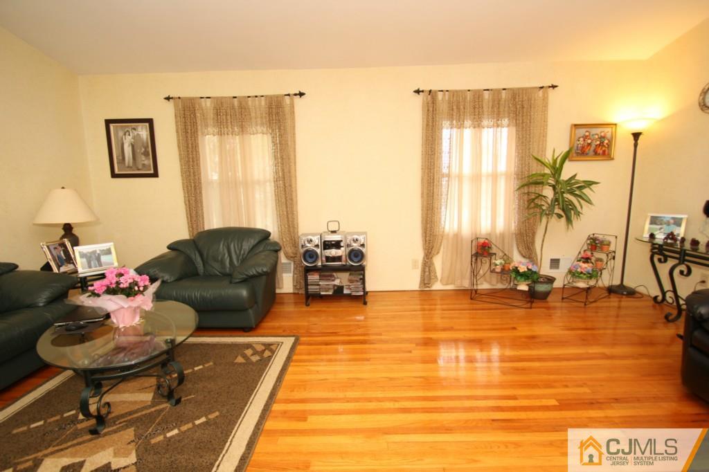 16 Gales Road Edison, NJ 08837 - Photo 3 of 25 a living room with furniture and a large window