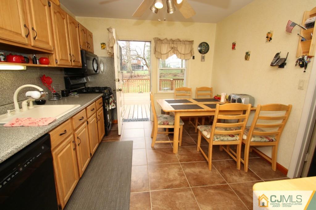 16 Gales Road Edison, NJ 08837 - Photo 5 of 25 a open kitchen with stainless steel appliances kitchen island granite countertop a sink and cabinets