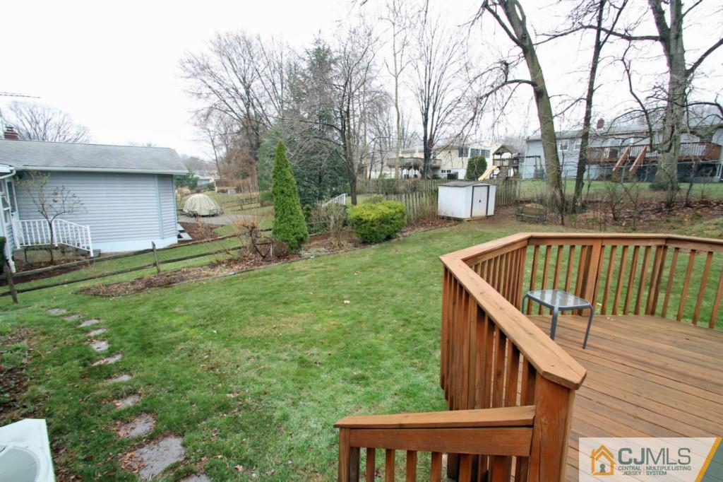 16 Gales Road Edison, NJ 08837 - Photo 8 of 25 a view of backyard with deck and outdoor seating