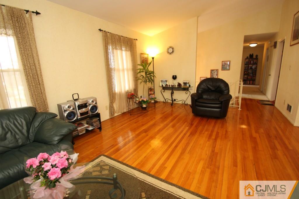 16 Gales Road Edison, NJ 08837 - Photo 9 of 25 a living room with furniture and wooden floor