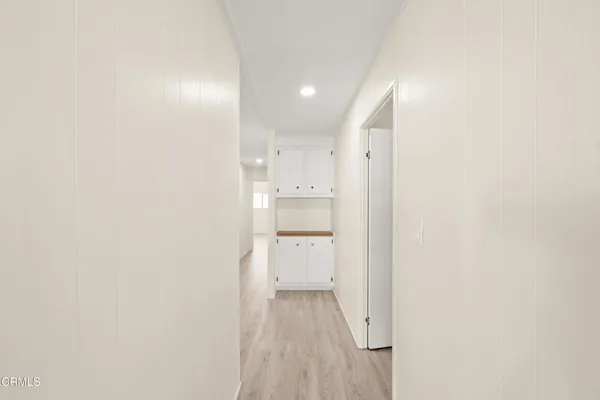 a view of a kitchen with white walls