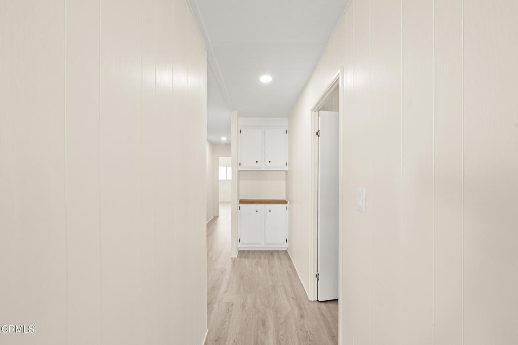 a view of a kitchen with white walls