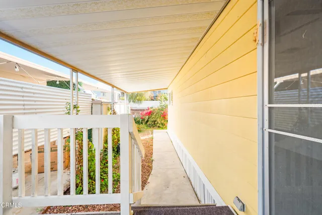 a view of swimming pool with outdoor seating space and lake view