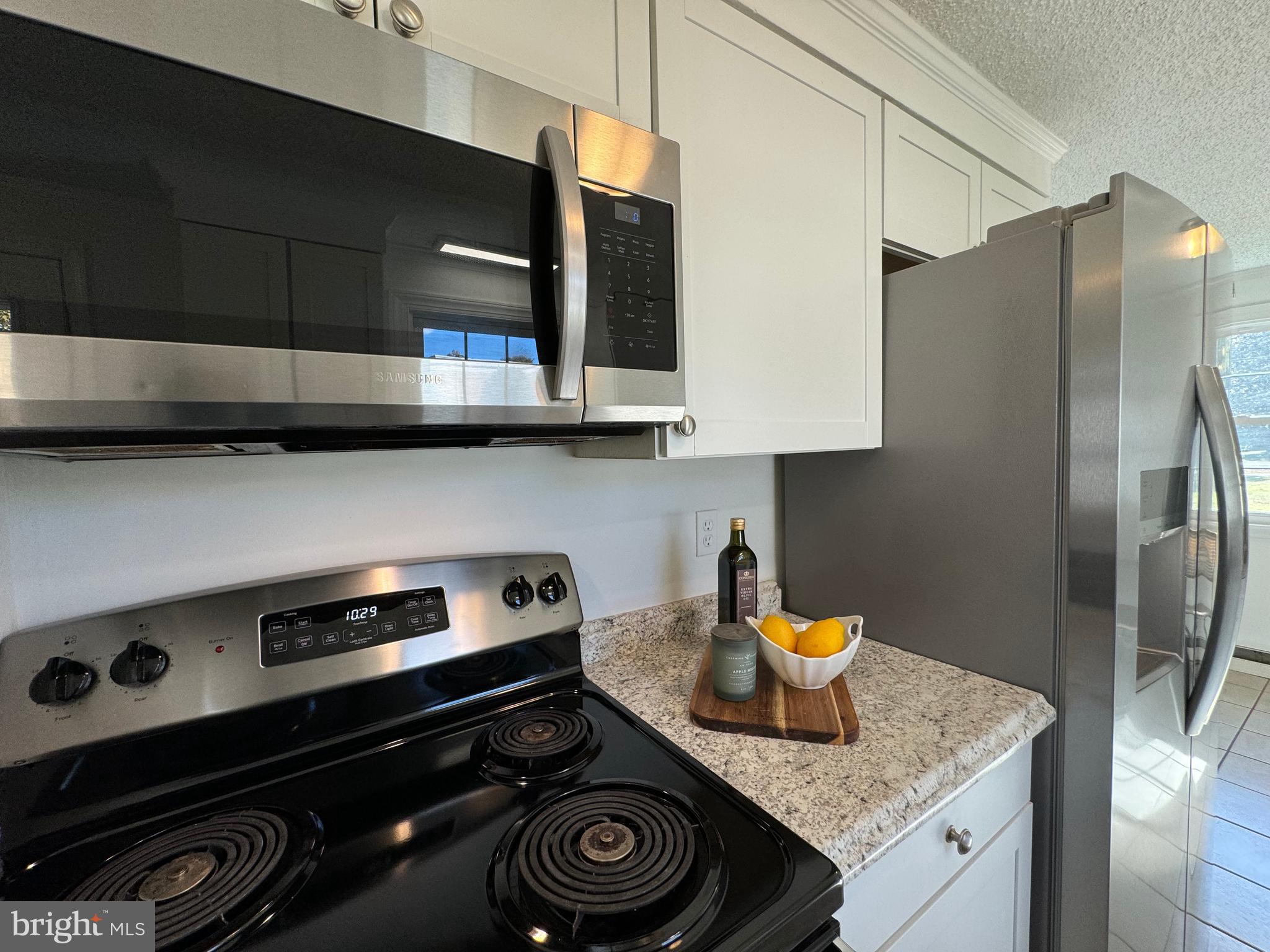 1581 Skinners Turn Road Owings, MD 20736 - Photo 16 of 37 a kitchen with a stove and a refrigerator