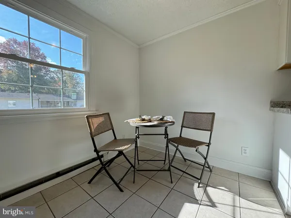 a view of a room with furniture and windows