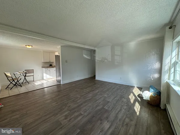 a view of livingroom and hardwood floor