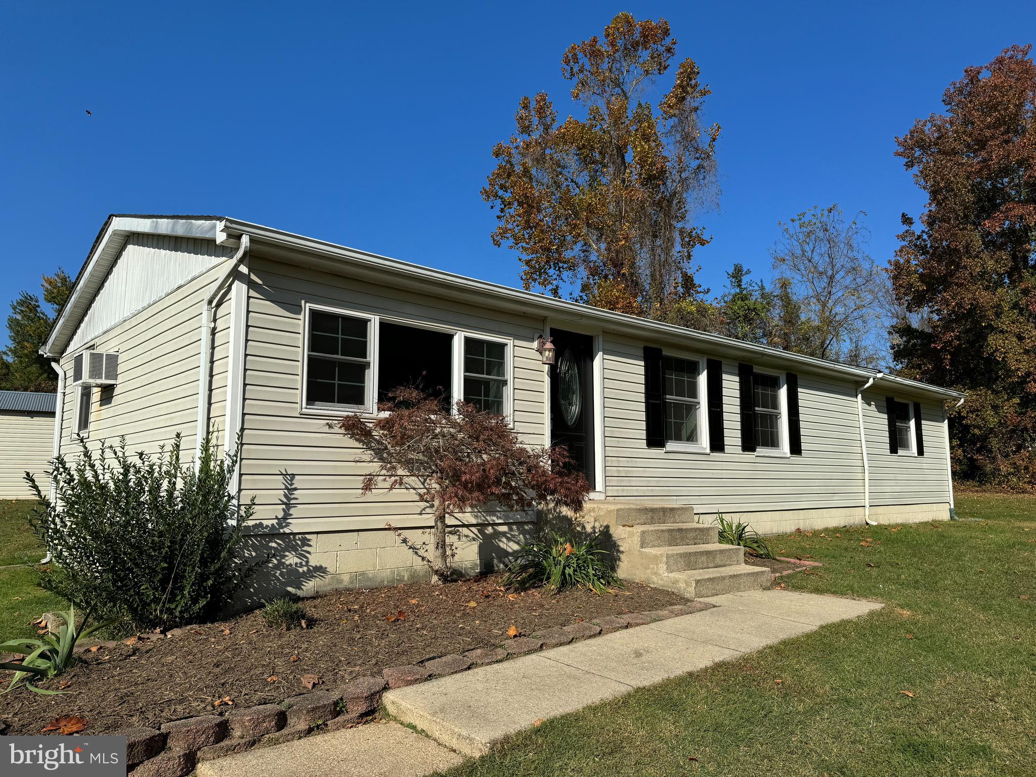 1581 Skinners Turn Road Owings, MD 20736 - Photo 2 of 37 a front view of a house with garden