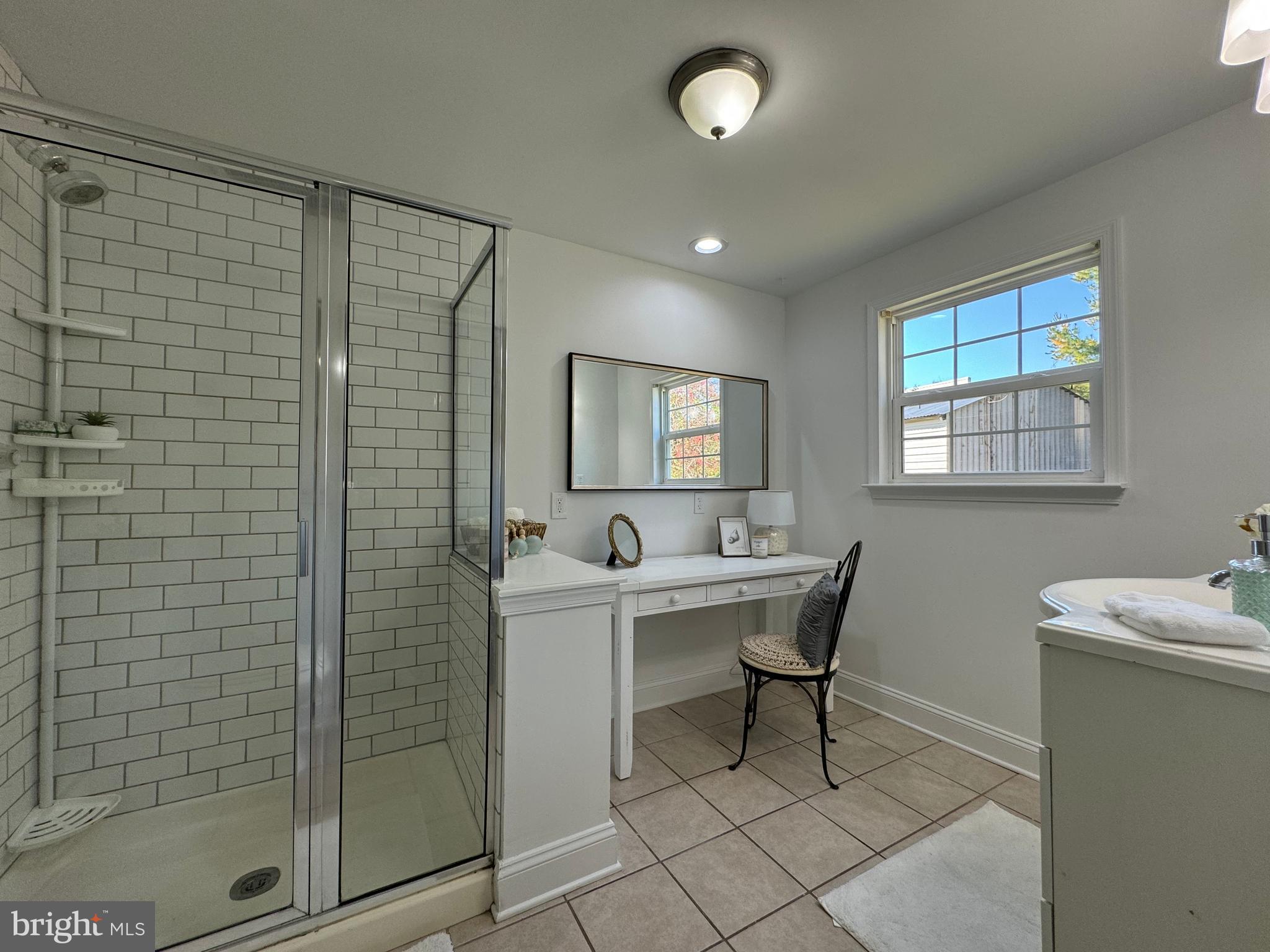 1581 Skinners Turn Road Owings, MD 20736 - Photo 31 of 37 a bathroom with a sink a toilet and shower