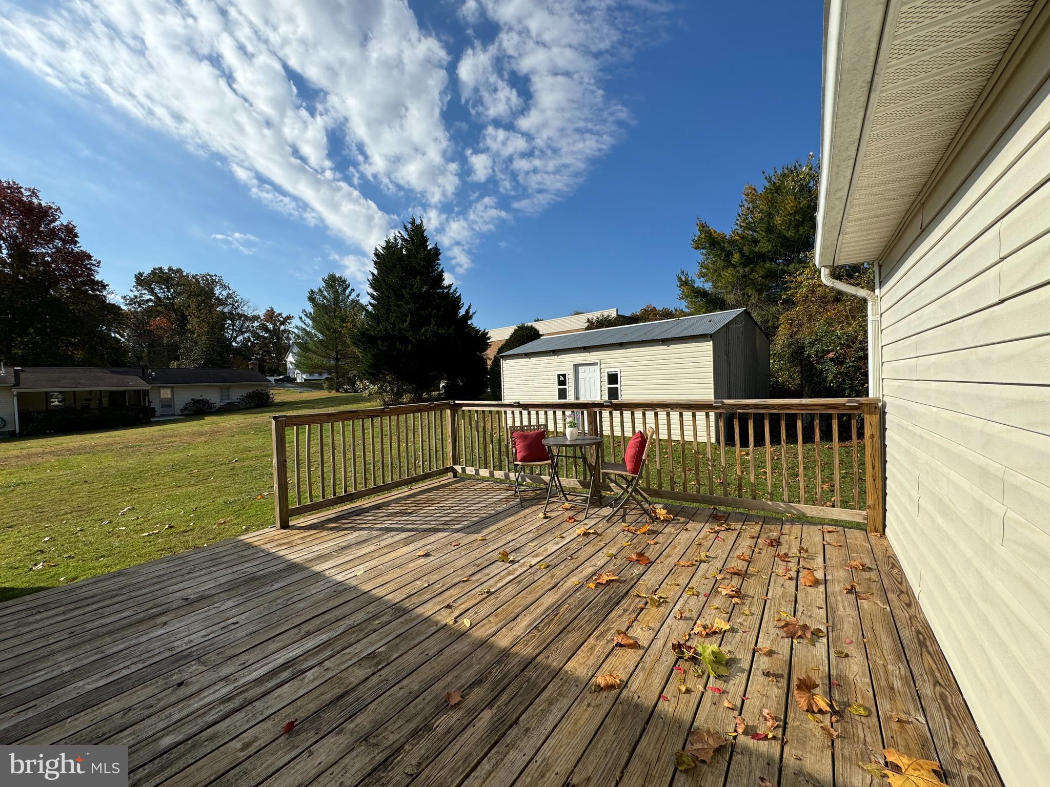 1581 Skinners Turn Road Owings, MD 20736 - Photo 6 of 37 a view of balcony with wooden floor and fence
