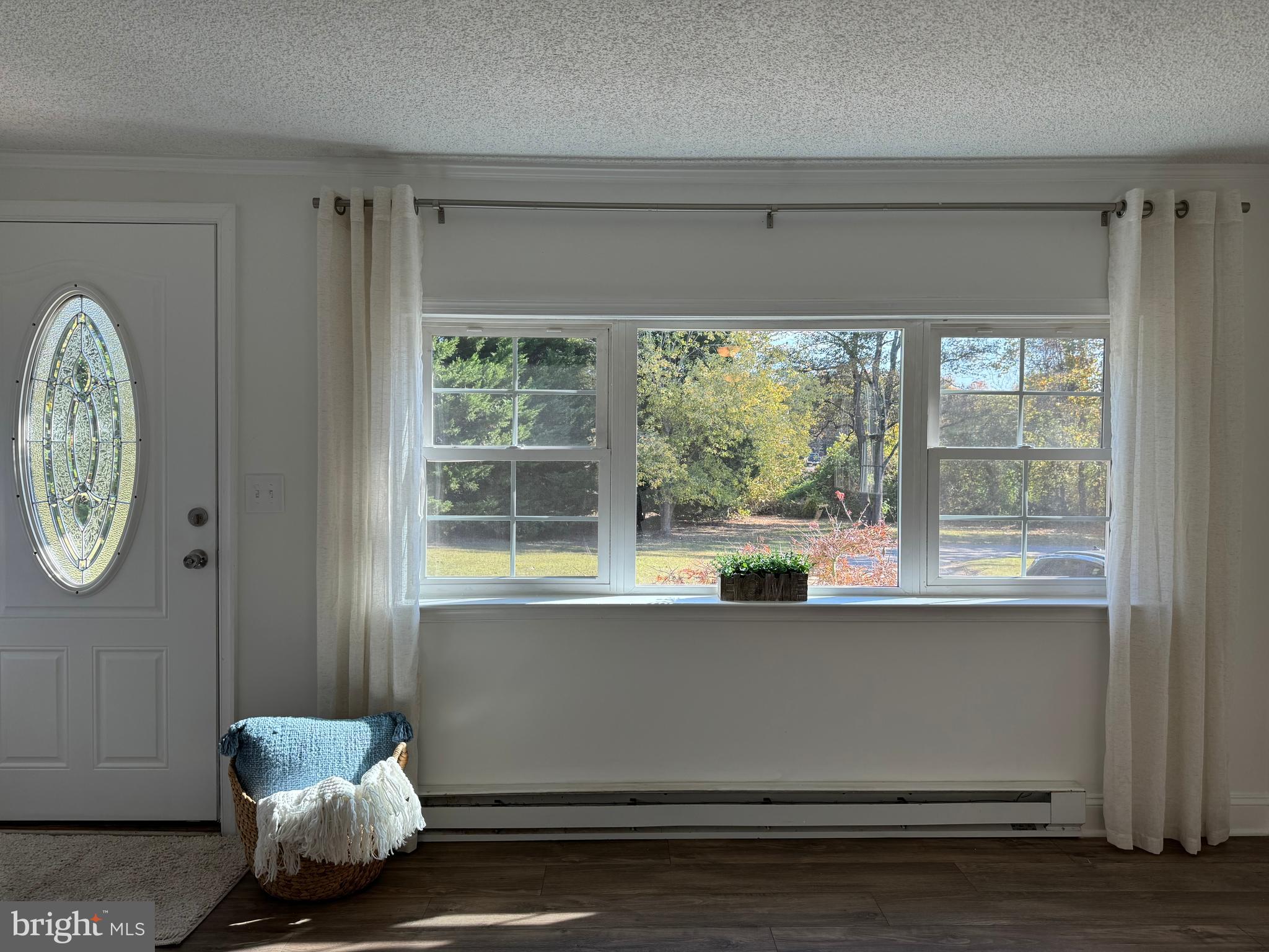 1581 Skinners Turn Road Owings, MD 20736 - Photo 10 of 37 a room with a window and a potted plant