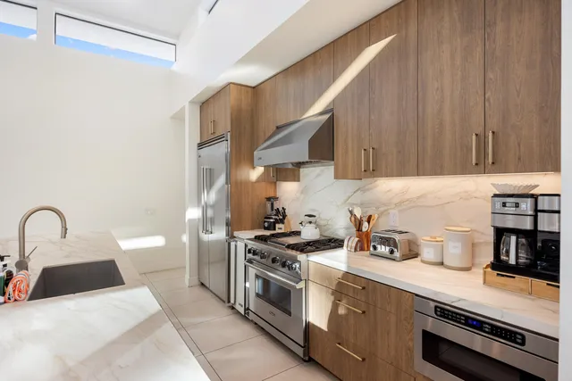 a bedroom with a bed and a night stand