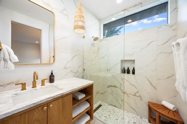 a bathroom with a tub and a shower