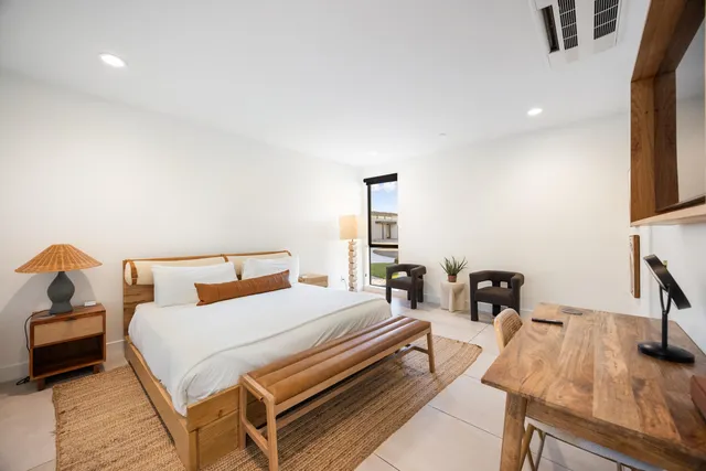 a view of a swimming pool with outdoor seating