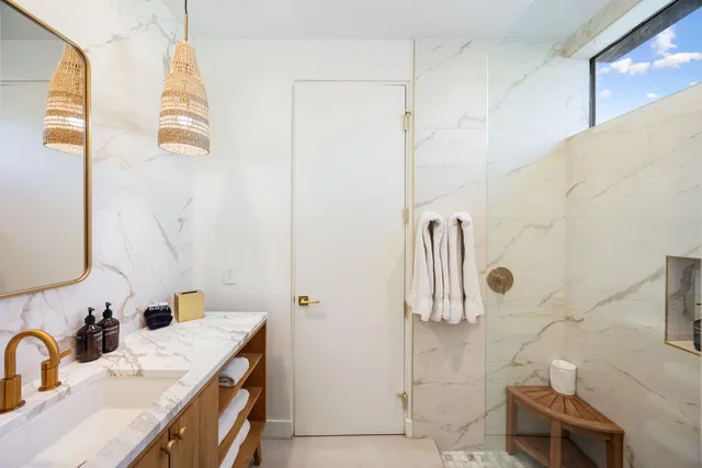 a view of a swimming pool with outdoor seating